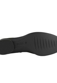 Schwarze Gummisohlen mit strukturierten Grip-Mustern und einer abgerundeten Form. Verfügt über ein sichtbares Logo und eine Größenmarkierung, designed für Komfort.