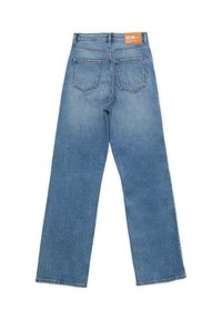 Light blue denim jeans with a straight leg cut, featuring two back pockets and a brown label at the waistband. Minimal stitching details.