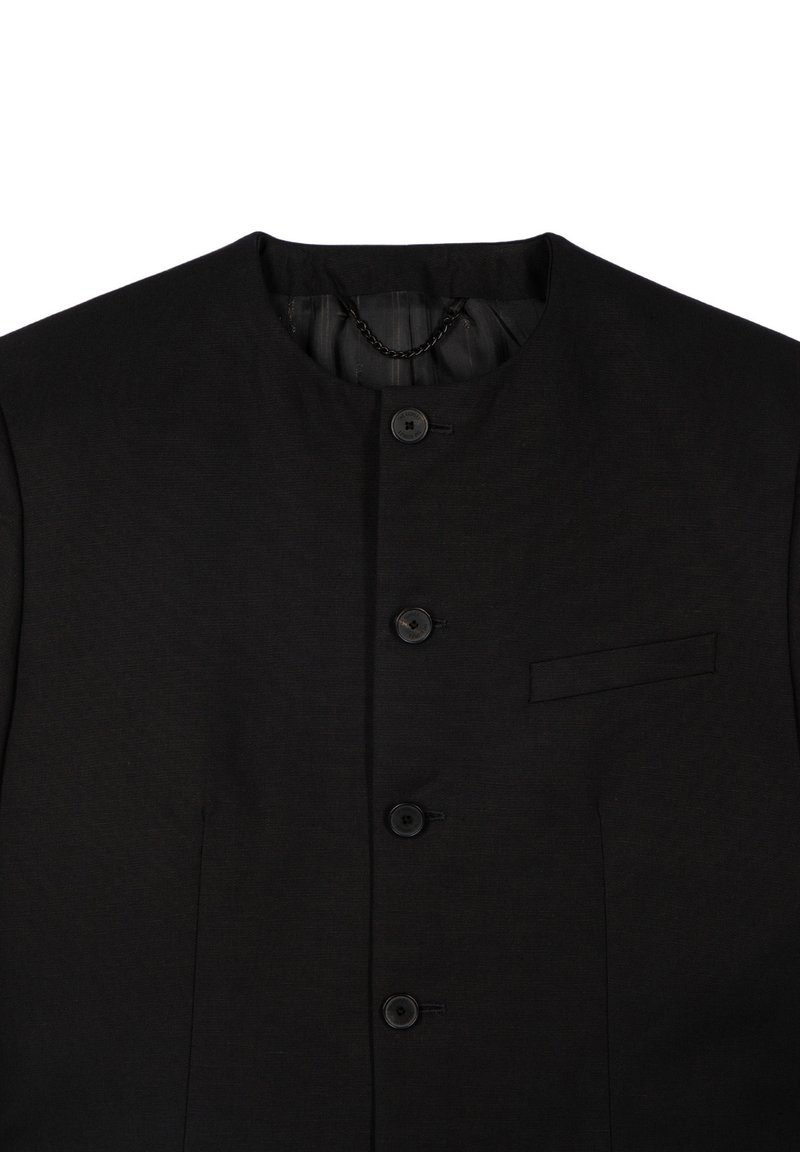 Black jacket with a high neckline, five buttons, a small chest pocket, and a smooth texture. Features a chain detail inside the collar.