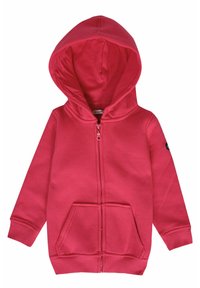Haut à capuche zippé rouge avec une texture douce, poches avant, poignets côtelés et une capuche avec cordon. Présente un logo sur la manche gauche.