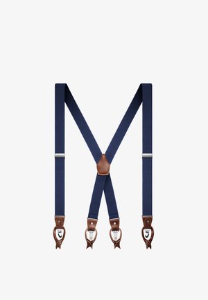 Marineblå seler med brunt læder og sølvfarvede metalclips, arrangeret i form af et X på en hvid baggrund.