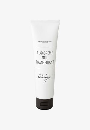 Weißer Tubus mit schwarzer Kappe, beschriftet mit "Fusscreme Anti-Transpirant" und "le Duigou Cosmétiqu", verfügt über einfachen schwarzen Text und ein minimales Design.