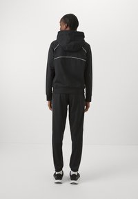 Under Armour RIVAL TRICOT TRACKSUIT SET - Verryttelypuku - black/white