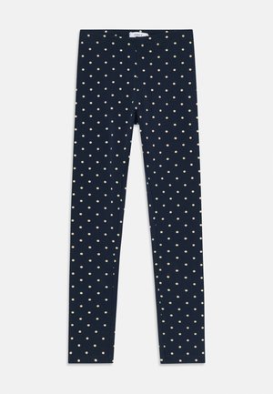 Leggings blu navy con un design aderente, caratterizzati da pois beige chiaro su tutta la superficie. Realizzati in un materiale morbido e elastico.