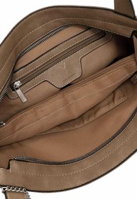 Beige leather handbag interior featuring a zippered pocket, smooth fabric lining, and two compartments with visible stitching details.