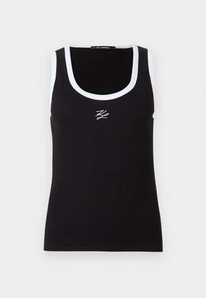 Débardeur noir à côtes avec un bord blanc et un col arrondi. Présente un petit logo brodé blanc à l'avant.