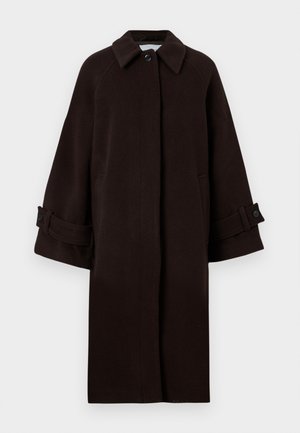 Manteau en laine brun avec un col, des manches raglan, une fermeture à boutons à l'avant et des poches latérales. Dispose de bracelets de poignet avec des boutons.