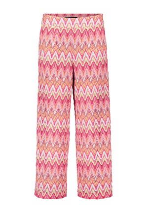Pantalons larges à motifs avec un design en zigzag en rose, orange et crème. Fabriqués dans un tissu texturé avec une taille élastique.