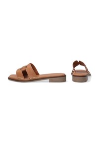 Brown leather slide sandals featuring a wide strap with a gold buckle, low wooden heel, and woven detailing along the side.