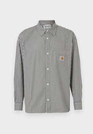 Schwarz-weiß gestreiftes Langarmhemd mit button-down Kragen. Verfügt über eine Brusttasche mit einem beigen Logo-Patch.