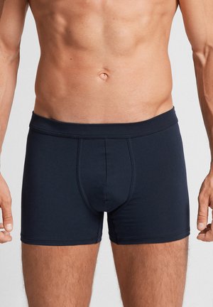 Dark navy boxers made of soft, stretchy fabric. Features a fitted design with a horizontal fly and elastic waistband. Smooth texture.