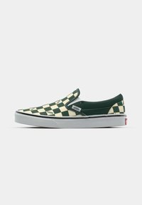 Grüne und beige Slipper mit einem Karomuster. Verfügt über einen gepolsterten Kragen, eine weiße Gummisohle und Vans-Logo-Akzente.