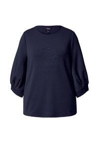 Topp marinblå med rund halslinje og trekvart puffede ermer. Myk, glatt stoff med en avslappet passform. Enkelt design uten mønstre.
