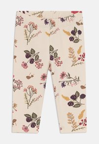 Helle Leggings zeigen ein florales Muster mit verschiedenen Pflanzen, Beeren und Blumen in Rosa-, Lila- und Grüntönen.