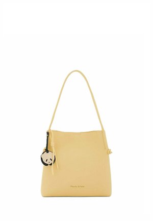 Borsa gialla con una singola tracolla e un portachiavi rotondo con la faccia di panda nero e beige attaccato sul lato sinistro.