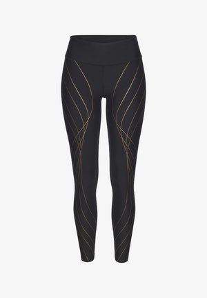 Damen schwarze Leggings mit goldenen Wirbelmustern. Hergestellt aus dehnbarem Stoff, mit einem breiten Bund und nahtlosem Design für zusätzlichen Komfort.