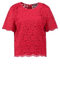 Top in pizzo rosso con maniche corte, scollatura rotonda, orlo ondulato e chiusura con zip sul retro. Tessuto leggero e motivo floreale.