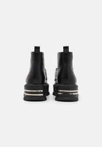 Koi Footwear THE SILENCE PLATFORM GRUNGE BOOTS UNISEX - Šněrovací kotníkové boty - black