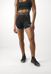 Puma FIT TRAIN STRONG SHORT - Leggingek - black