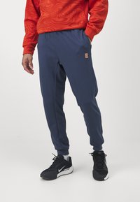 Nike Performance HERITAGE PANT - Tréningruha alsók - thunder blue