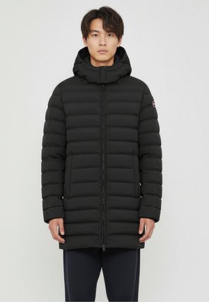 Black puffer jacket with a zip front, a detachable hood, and horizontal quilting. Features two front pockets and a logo on the sleeve.