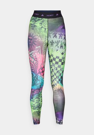 Leggings colorés présentant une variété de motifs en vert, rose et bleu, avec une taille noire portant l'inscription "TECHFIT" et divers designs graphiques.