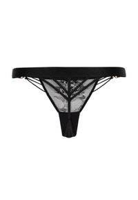 String noir en tissu doux avec des accents en dentelle. Présente un motif floral transparent à l'arrière et des détails de fines bretelles.