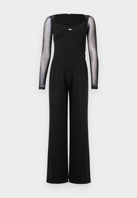 Combinaison noire à manches longues en maille transparente, col carré, taille cintrée et pantalons larges sur un fond uni.