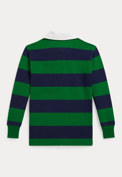 Garā piedurknēm polo krekls ar zaļiem un tumši ziliem horizontāliem svītrainēm, baltu apkakli un ribotas aproces. Izgatavots no mīksta, elpojoša auduma.