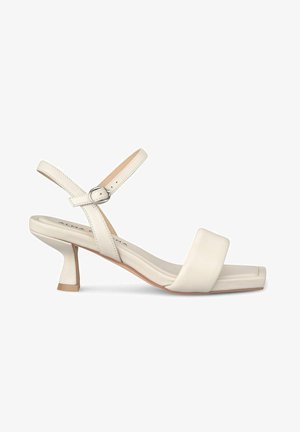 Witte leren hoge sandalen met vierkante neus, enkelsluiting en blokhak. Glad oppervlak en minimaal ontwerp met subtiele stiksels.