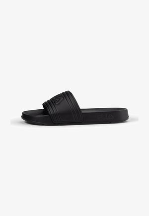 Mule en caoutchouc noir avec un design de bride surélevée, surface texturée et un léger talon. Logo embossé sur le côté pour le branding.