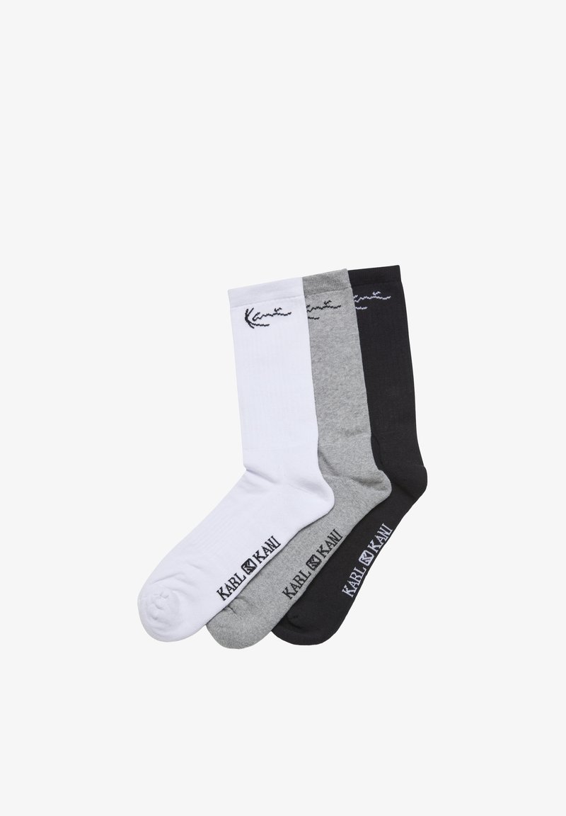 Trois paires de chaussettes montantes en blanc, gris et noir, chacune arborant la marque « KARL KANI » et un petit logo près du bord-côte.