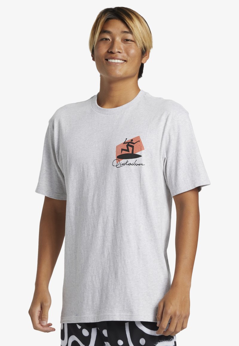 Light gray cotton t-shirt featuring a black and coral graphic design on the left chest. Crew neck and short sleeves, relaxed fit.