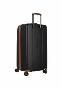 Valise rigide noire avec des accents marron, équipée d'une poignée rétractable et de quatre roulettes multidirectionnelles pour une mobilité facile.