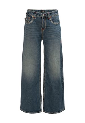 Dżinsy o szerokich nogawkach w średnim odcieniu niebieskiego z delikatnym efektiem wyblaknięcia. Posiadają pomarańczowe przeszycia, pięć kieszeni oraz zapięcie na guzik z przodu.