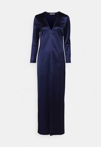 Navy satin dress features a deep V-neck, long sleeves, and a straight silhouette with a front slit for added detail.