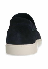 Navy suede shoe with a round toe, cushioned sole, and a contrasting cream-colored outsole. Smooth texture and minimalistic design.