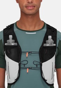 Black and white running vest with adjustable straps, two grey water bottles, and orange accents. Lightweight fabric with mesh sections.