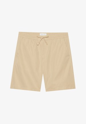 Béžové plavky s elastickým pasem, šňůrkou, dvěma bočními kapsami a hladkým povrchem. Obsahují minimalistický design.