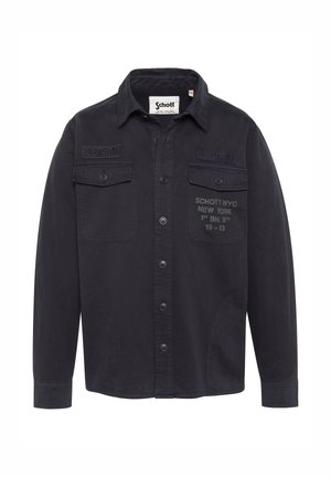 Chemise noire à manches longues avec boutons, dotée de deux poches poitrine et de textes imprimés, comprenant les écussons "Schott NYC" et "US 740N".