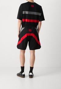 HUGO Verryttelyhousut - black