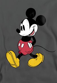 Black and white cartoon character with large ears, red shorts, and yellow shoes, against a gray background, displaying a worn texture.