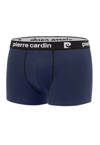 Boxers bleus marine avec un design ajusté, fabriqués en tissu doux. Ils présentent une ceinture noire contrastante avec un lettrage de marque blanc.