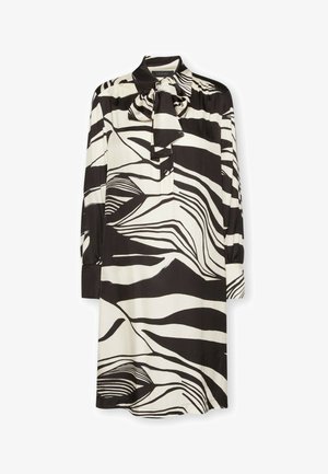 Vestito con motivo a fantasia bianco e nero, con colletto, maniche lunghe e dettaglio a fiocco sullo scollo. Realizzato in tessuto liscio e leggero.