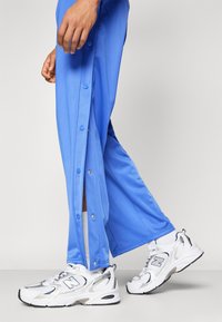 YOURTURN ADAPT RETRO JOGGER - Trainingsbroek - blue