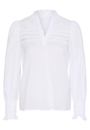 Weiße Bluse mit langen Ärmeln, Rüschen-Ausschnitt und gerafften Manschetten. Mit horizontalen Ausschnitten an der Vorderseite. Leichter Stoff.