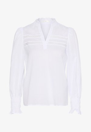 Bílá blůza s dlouhými rukávy, volánkovým výstřihem a nařasenými manžetami. Obsahuje horizontální výřezové detaily přes přední stranu. Lehká tkanina.