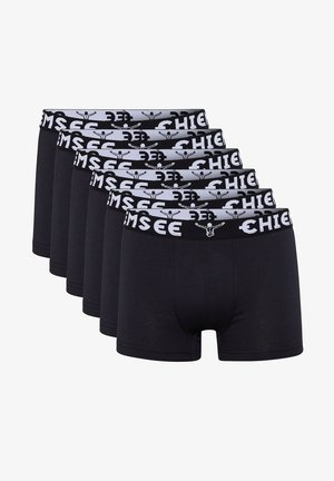 Black cotton boxer shorts displayed in a row, featuring a gray waistband with black text and logo pattern. Six pairs are visible.