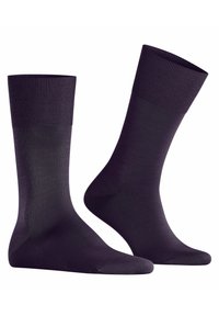 Calzini viola con un polsino a coste e un corpo liscio. Realizzati in un materiale morbido e elastico per il massimo comfort. Lunghezza a metà polpaccio con un design senza cuciture.