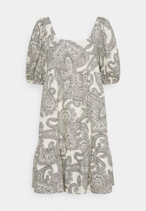 Robe légère crème à motif cachemire noir. Comprend des manches bouffantes, un décolleté carré et une jupe à volants.